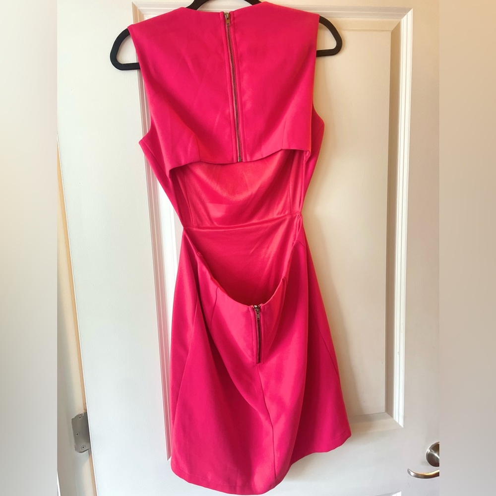 Open back above the knee length dress is lined through the skirt.